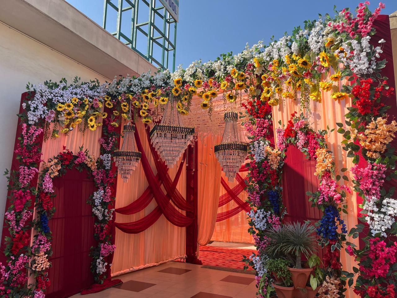 Decorated mandap at Red Oak Banquets at golden hour